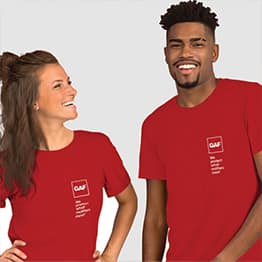 Man and woman wearing red GAF t-shirts.