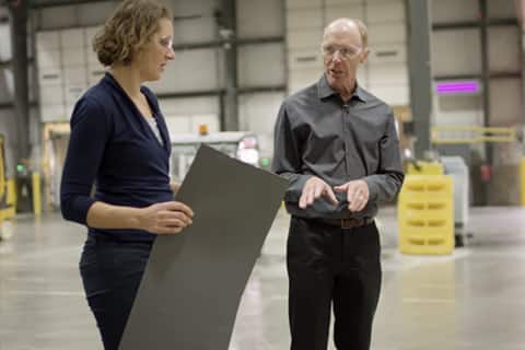 GAF business and roofing science architects discussing designs in a warehouse
