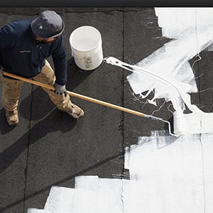 applying coating systems to a low-slope roof