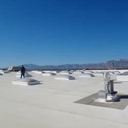 GAF commercial contractor on top of flat roof with EverGuard TPO